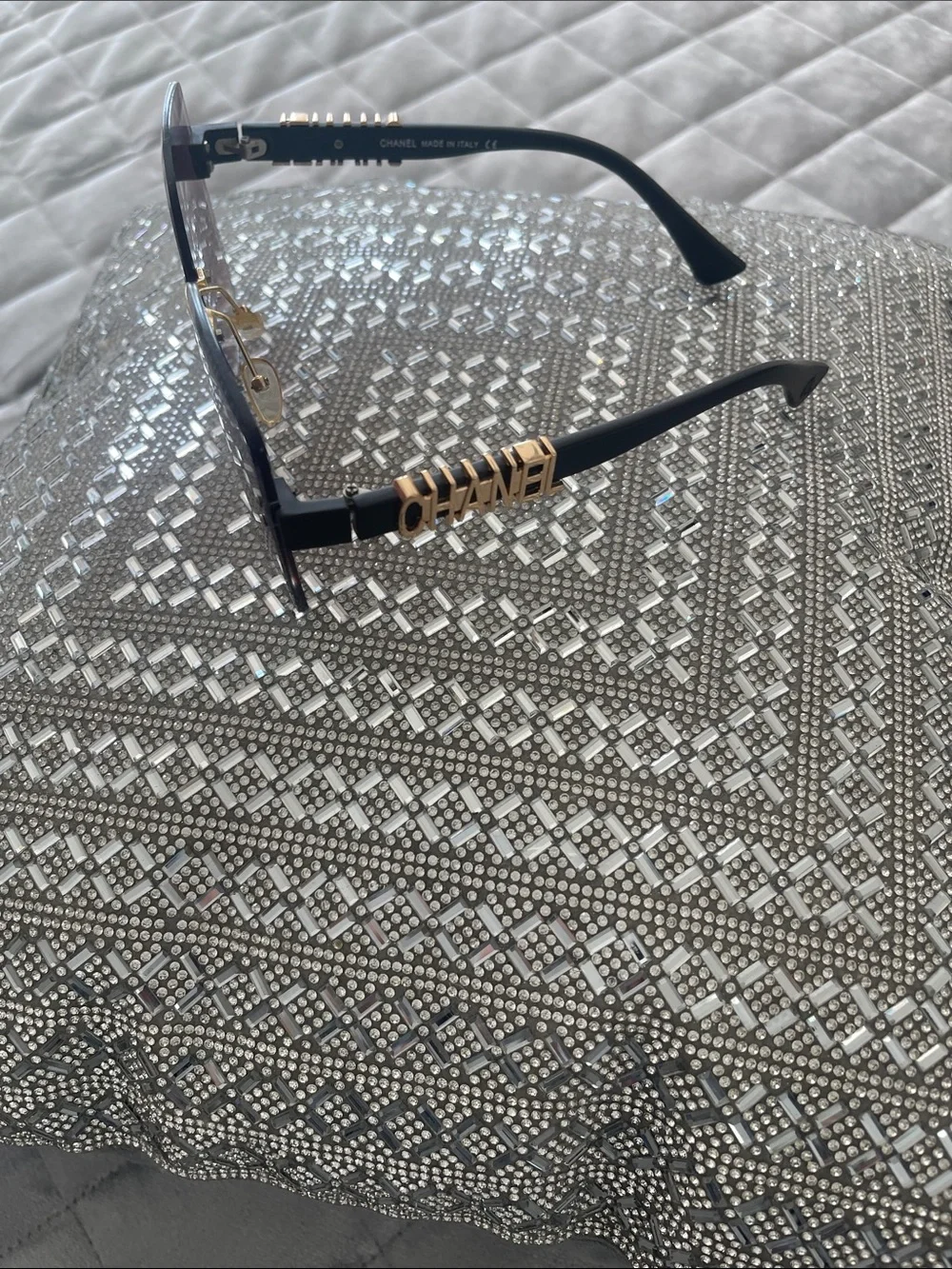 CHANEL Black Frames with Gold Trim and Burgundy Lenses Accent Pillow Display